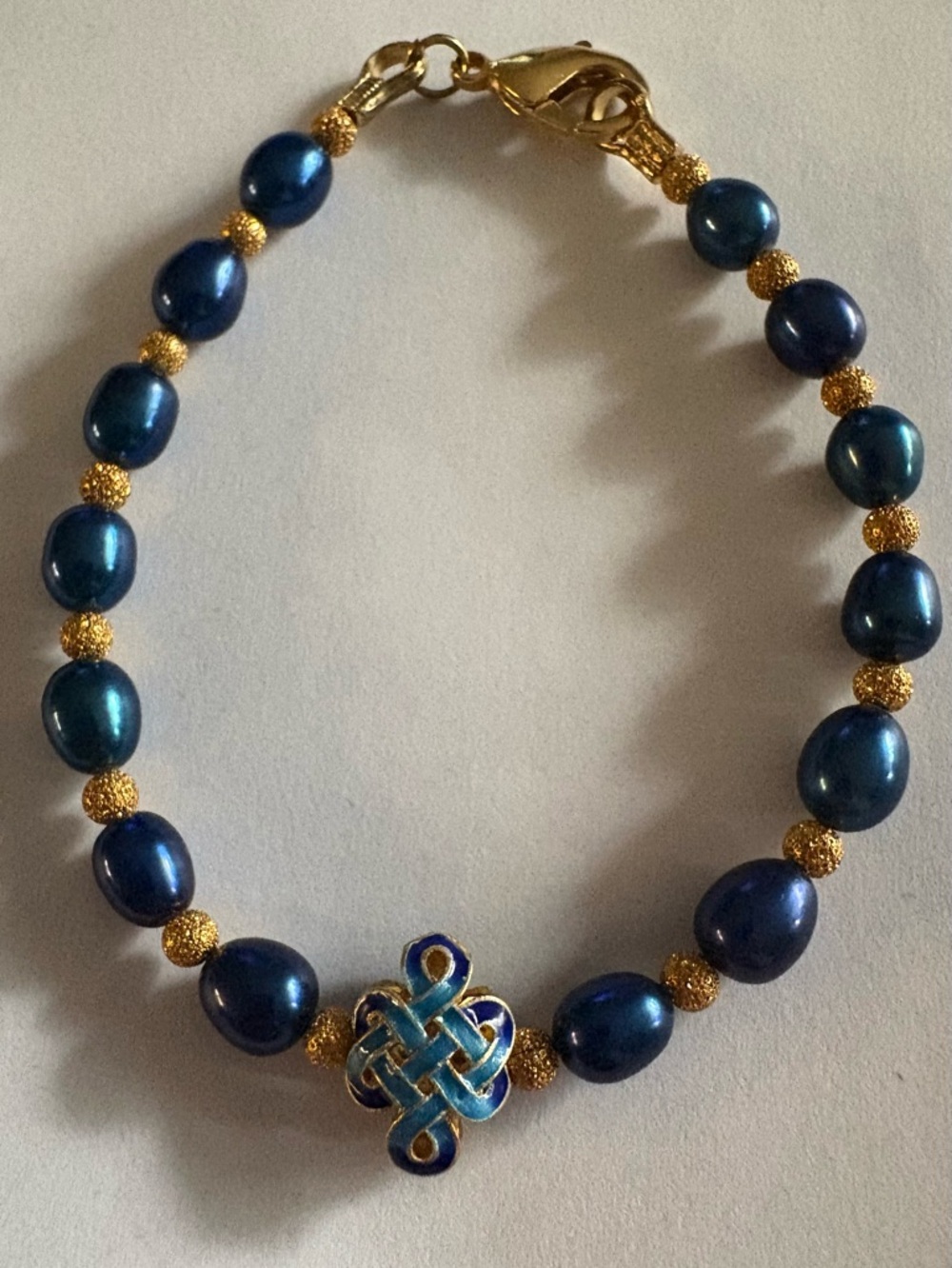 Peacock real blue Pearl Gold 
Bracelet with enamel knot bead  7.5”